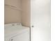 Laundry room features a white dryer and a wire shelf at 9668 Hollyhill Dr, Orlando, FL 32824