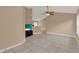 Bright living room featuring tile floors, vaulted ceiling, a ceiling fan and open floor plan at 9668 Hollyhill Dr, Orlando, FL 32824