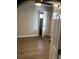 Bedroom with luxury vinyl flooring, ceiling fan, and bathroom access at 1010 Dakota Ave, St Cloud, FL 34769