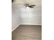 Bedroom features ceiling fan, luxury vinyl flooring, and light gray walls at 1010 Dakota Ave, St Cloud, FL 34769