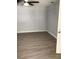 Bedroom features modern ceiling fan, luxury vinyl flooring, and light gray walls at 1010 Dakota Ave, St Cloud, FL 34769