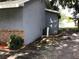 Exterior side shot of home, showing air conditioning unit and brick foundation at 1010 Dakota Ave, St Cloud, FL 34769