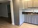 Recently remodeled kitchen features modern appliances, gray cabinets, and a stylish marble backsplash at 1010 Dakota Ave, St Cloud, FL 34769