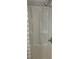 New shower with shelving on side and shower curtain at 1010 Dakota Ave, St Cloud, FL 34769