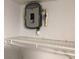 Close up of a modern Rheem Performance water heater sitting above a white wire rack at 1010 Dakota Ave, St Cloud, FL 34769