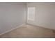 Bright bedroom with neutral carpet features ample natural light from a large window at 1034 Enclair St, Orlando, FL 32828