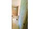 Small bathroom with tub and patterned wallpaper at 106 Azalea Trl, Leesburg, FL 34748