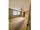 Bedroom with ceiling fan and two windows with mini blinds at 106 Azalea Trl, Leesburg, FL 34748
