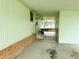 Covered carport area with access to the house and backyard at 106 Azalea Trl, Leesburg, FL 34748