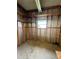 Utility room with open framing, window, and concrete floor at 106 Azalea Trl, Leesburg, FL 34748