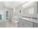 Bathroom featuring shower, vanity, and access to the pool at 115 Henue Ct, Davenport, FL 33896