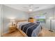Comfortable bedroom overlooking the pool area, featuring hardwood floors and natural light at 115 Henue Ct, Davenport, FL 33896