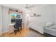 Bright bedroom, desk and chair, and hardwood floors at 115 Henue Ct, Davenport, FL 33896