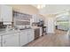 Functional kitchen with stainless steel appliances, and views of the dining and living spaces at 115 Henue Ct, Davenport, FL 33896