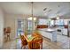 Open dining area seamlessly connecting to the kitchen, creating an inviting atmosphere at 130 Evergreen Dr, Auburndale, FL 33823