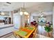 Open-concept living spaces seamlessly connecting the kitchen, dining area, and living room at 130 Evergreen Dr, Auburndale, FL 33823