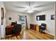 Home office with hardwood floors, a work desk, and a comfortable office chair at 130 Evergreen Dr, Auburndale, FL 33823