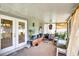 Enclosed patio with ample room for seating and plants and sliding glass door at 130 Evergreen Dr, Auburndale, FL 33823
