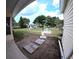Open backyard view with stepping stones, a table with bench seating, and surrounding trees for privacy at 15 Ne 63Rd Ct, Ocala, FL 34470