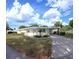 Attractive home featuring an attached carport and well-maintained landscaping, creating a welcoming atmosphere at 15 Ne 63Rd Ct, Ocala, FL 34470