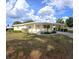 Charming single-story home with a covered carport and well-maintained lawn, perfect for relaxed living at 15 Ne 63Rd Ct, Ocala, FL 34470