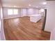 Spacious living area with a large kitchen island, hardwood floors, and lots of natural light perfect for Gathering at 15 Ne 63Rd Ct, Ocala, FL 34470