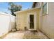 Back porch with brick flooring and white fence, offering a relaxing outdoor retreat at 1502 Hempel Ave, Windermere, FL 34786