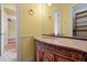 Bathroom featuring a vanity with ornate wood carvings, a vessel sink, and stylish fixtures at 1502 Hempel Ave, Windermere, FL 34786