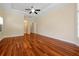 This light-filled bedroom boasts hardwood floors, neutral walls, and recessed lighting at 1502 Hempel Ave, Windermere, FL 34786