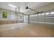 Spacious garage with two windows and two garage doors, offering ample parking and storage space at 1502 Hempel Ave, Windermere, FL 34786