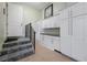 Garage with storage cabinets and stairs, providing organization and functionality at 1502 Hempel Ave, Windermere, FL 34786
