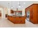 Gourmet kitchen featuring granite countertops, and stainless steel refrigerator at 1502 Hempel Ave, Windermere, FL 34786