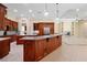 Gourmet kitchen featuring custom cabinetry, granite countertops, and stainless steel appliances at 1502 Hempel Ave, Windermere, FL 34786