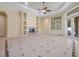 Expansive living room with tile floors, a fireplace, built-in shelving, and access to the outdoor area at 1502 Hempel Ave, Windermere, FL 34786