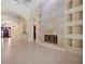 Spacious living room with tile flooring, fireplace, built-in shelving, and elegant archways at 1502 Hempel Ave, Windermere, FL 34786