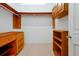 Custom walk-in closet features built-in shelving and drawers, providing ample storage space at 1502 Hempel Ave, Windermere, FL 34786