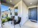 Cozy front porch with seating offers a relaxing outdoor space at 2044 Keystone Pass Blvd, Minneola, FL 34715