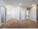 Hallway with carpeted floor leading to various rooms at 2044 Keystone Pass Blvd, Minneola, FL 34715