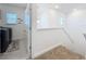 Bright laundry room featuring a modern washer and dryer, plenty of storage, and natural light at 2044 Keystone Pass Blvd, Minneola, FL 34715