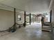 Covered outdoor space featuring a concrete floor and views of the backyard and gazebo at 24505 Snail Rd, Astor, FL 32102