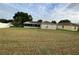Spacious backyard with a screened-in porch offering outdoor living space at 2470 Augusta Way, Kissimmee, FL 34746