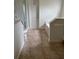 Bathroom featuring tiled floor, separate shower, and large tub at 2470 Augusta Way, Kissimmee, FL 34746
