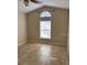 A bedroom with a vaulted ceiling, natural light and neutral paint, ready for furnishing at 2470 Augusta Way, Kissimmee, FL 34746