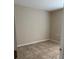 A cozy bedroom with tiled floors and neutral paint, ready for personalization at 2470 Augusta Way, Kissimmee, FL 34746