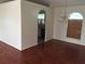 Bright dining room featuring hardwood floors, chandelier, and natural light from a large window at 2470 Augusta Way, Kissimmee, FL 34746