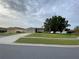 Charming single-story home with a well-kept lawn and mature trees at 2470 Augusta Way, Kissimmee, FL 34746