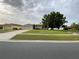 A well-maintained home with a lawn and an attached two-car garage at 2470 Augusta Way, Kissimmee, FL 34746