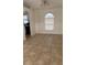 A bright living room features tiled floors and a window offering natural light at 2470 Augusta Way, Kissimmee, FL 34746