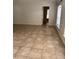 Spacious living room featuring tile flooring and natural light from a large window at 2470 Augusta Way, Kissimmee, FL 34746
