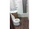 Standard bathroom featuring wood grain floors and a shower/tub combo at 2822 S Dean Rd, Orlando, FL 32825